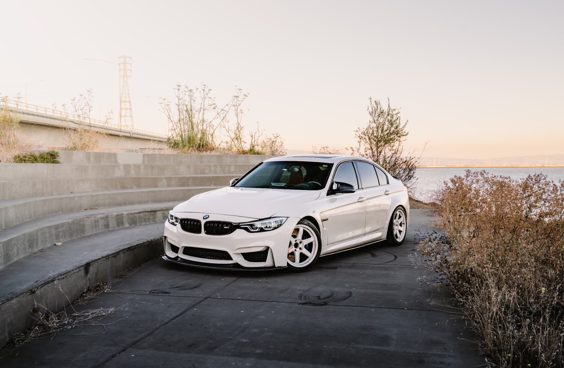BMW M3 F80 front three-quarter at the waterfront