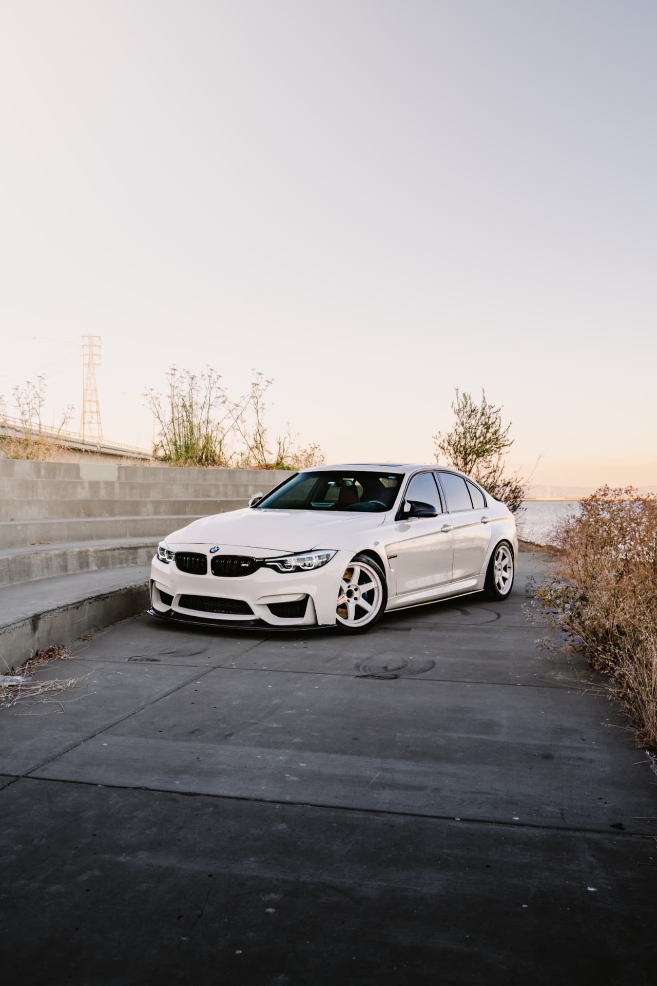 BMW M3 F80 at the waterfront at golden hour