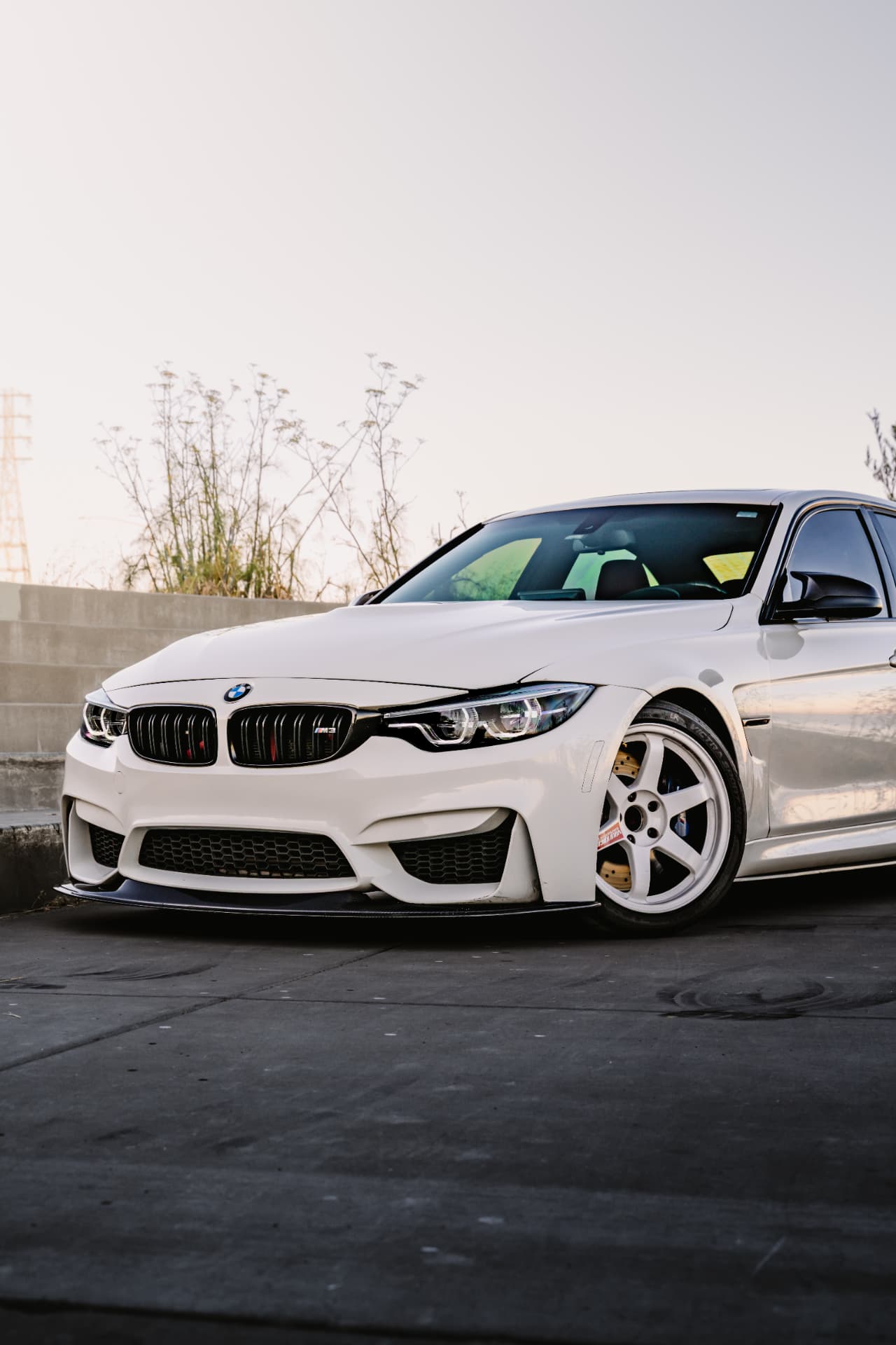 BMW M3 F80 front three-quarter at sunset